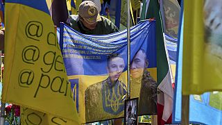 A Columbian volunteer of the Ukrainian army International Legion bows his head to commemorate his compatriots, who were killed on the battlefield in Ukraine.