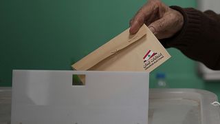 A Lebanese man casts his ballot at a polling station during municipal elections in the southern suburbs of Beirut, 4 May 2025