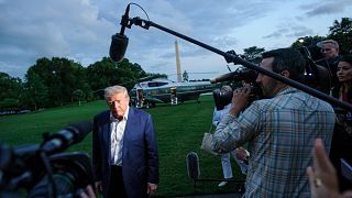 President Donald Trump speaks with reporters after disembarking Marine One upon arrival on the South Lawn of the White House in Washington, Sunday, May 4, 2025.