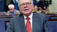 In this Monday, July 18, 2011, file photo, Warren Buffett is interviewed in the White House Briefing Room in Washington, following a meeting with President Barack Obama. 