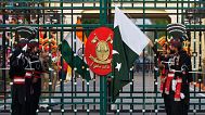 Pakistan's Rangers soldiers and Indian Border Security Forces soldiers lower their flags during a daily closing ceremony at the Wagah, 3 May 2025.