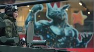 Russian soldiers sit at a tank driving along Tverskaya street to attend a rehearsal for the Victory Day military parade in Moscow, Russia, on Tuesday, April 29, 2025