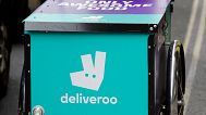 FILE - This July 11, 2017 file photo, shows a deliveroo logo on a bicycle in London.
