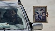 Palestinian resident of the West Bank refugee camp of Nur Shams carries his family photo while evacuates his home ahead of planned demolitions by Israeli security, 06.05.2025