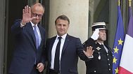 French President Emmanuel Macron, center, welcomes German Chancellor Friedrich Merz Wednesday, May 7, 2025 at the Elysee Palace in Paris.