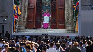 A giant screen in St Peter's Square shows closing of the doors to the Sistine Chapel during the cardinals' conclave to elect a new pope at the Vatican, 8 May 2025