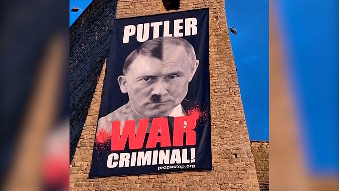 Estonia's Narva Museum displays controversial Putin-Hitler banner