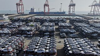 New cars waiting for shipment to overseas markets at a port in Taicang in eastern China's Jiangsu province, 7 April, 2025