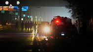 Pakistani police officers remove vehicles and people from the main entry of Nur Khan airbase following an Indian missile strike in Rawalpindi, Pakistan, Saturday, May 10, 2025