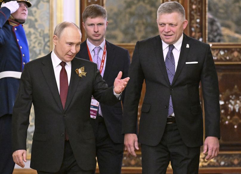 Russian President Vladimir Putin, left, and Slovakia's Prime Minister Robert Fico enter the hall during their meeting in Kremlin, Moscow, Russia, Friday, May 9, 2025