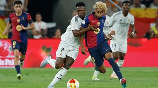 Barcelona's Lamine Yamal, right, fights for the ball with Real Madrid's Vinicius Junior during the Spanish Copa del Rey final, April 2025.
