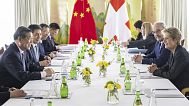 Chinese Vice Premier He Lifeng, left, Swiss Economy Minister Federal Councillor Guy Parmelin, center, Switzerland's President Karin Keller-Sutter, right, Geneva, 10.05.2025