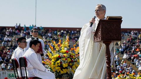 Pope Leo XIV, then Apostolic Administrator of Chiclayo Robert Prevost, preaches during a Corpus Christi celebration in a stadium in Chiclayo in 2015. 