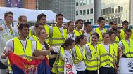 Students participating in the ultramarathon relay from Novi Sad, Serbia, arrive at their final destination, Brussels, Monday, May 12, 2025