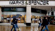 Pedestrians pass a branch of Marks and Spencer at Marble Arch in London, Tuesday, May 19, 2009.