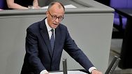 Friedrich Merz delivers his first speech as German Chancellor in the parliament in Berlin, Germany, Wednesday, May 14, 2025