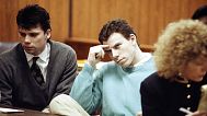 FILE- Lyle Menendez, left, and his brother, Erik, sit at the defense table during a hearing in a Beverly Hills, Calif., courtroom, April 3, 1991.