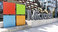FILE - A Microsoft sign and logo are pictured at the company's headquarters, Friday, April 4, 2025, in Redmond, Wash. (AP Photo/Jason Redmond, File)