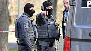 FILE: Officers from the police defusing service stand near a damaged vehicle on an access road to the Rhine bridge, in Mannheim, Germany, Monday, March 3, 2025