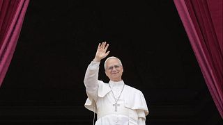 Pope Leo XIV appears on the central balcony of St Peter's Basilica at the Vatican to bless the crowd below on 11 May 2025.