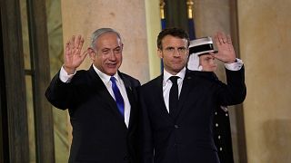 French president Emmanuel Macron welcomes Israeli Prime Minister Benjamin Netanyahu prior to their meeting at the Elysee Palace, 2 February 2023