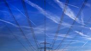 FILE - In this Nov. 1, 2017 file photo high power cables hang from a pole on a field in Hattersheim, Germany.