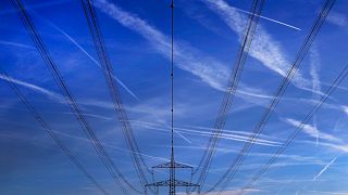 FILE - In this Nov. 1, 2017 file photo high power cables hang from a pole on a field in Hattersheim, Germany.