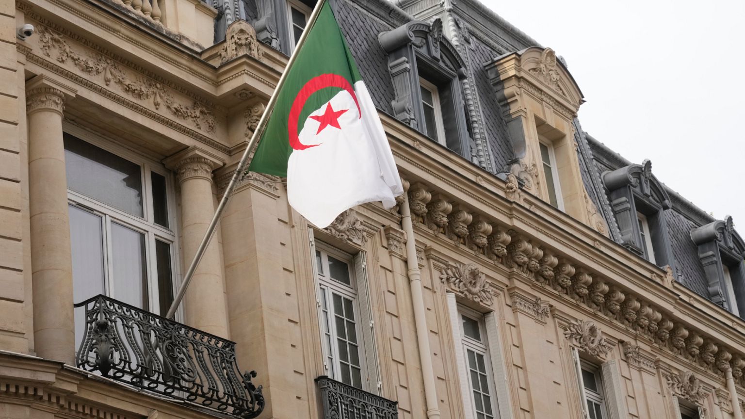 The Algerian national flag is seen in front of the country's embassy in Paris, Wednesday, 16 April 2025.