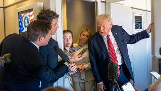 US President Donald Trump speaks to reporters aboard Air Force One en route from Riyadh to Doha, Wednesday, 14 May 2025