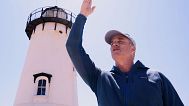 Endurance swimmer Lewis Pugh gestures to where he will begin his swim around Martha's Vineyard island, which is expected to take 12 days.