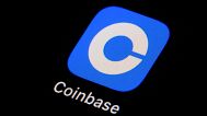 The Coinbase app icon is seen on a smartphone in 2023.