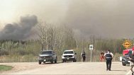 Authorities patrol an area in the central Canadian province of Manitoba where a massive wildfire broke out, killing two people, Lac de Bonnet, Manitoba, Canada, May 15, 2025