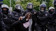 Police officers arrest a pro-Palestinians during a demonstration to commemorate the Nakba Day in Berlin, Germany, Thursday, May 15, 2025. 