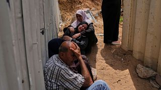 Palestinians mourn their relatives who were killed in Israeli airstrikes on a medical center in Jabalia, northern Gaza Strip, on Thursday, May 15, 2025. 