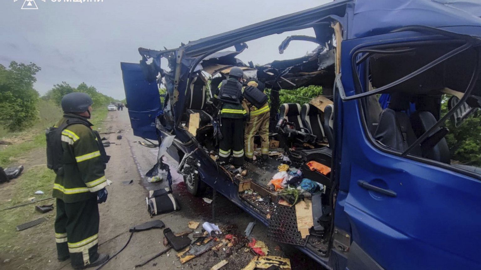 Rescuers recover the bodies of passengers after a Russian drone struck a passenger bus at the village of Bilopillya in the Sumy region, Ukraine, Saturday, May 17, 2025.