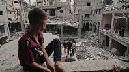 Palestinians inspect the rubble of the Al-Lahham family's home, destroyed by Israeli airstrikes in Khan Younis, Gaza Strip, on Thursday, May 15, 2025.