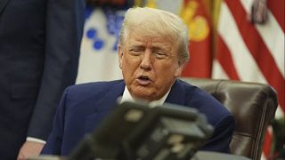 President Donald Trump speaks on the phone to Britian's Prime Minister Keir Starmer in the Oval Office of the White House, Thursday, May 8, 2025, in Washington.