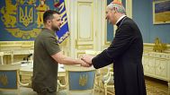 Ukrainian President Volodymyr Zelenskyy shakes hands with Cardinal Matteo Zuppi, head of the CEI (Italian Conference of Bishops) in Kyiv, Ukraine, Tuesday, June 6, 2023.