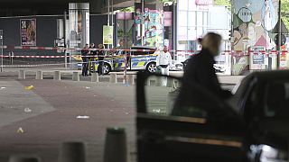 Police and forensic investigators are on the scene following an attack in the western city of Bielefeld, Germany, Sunday May 18, 2025. (Christian Müller/dpa via AP)