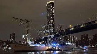 A masted Mexican Navy training ship, the Cuauhtémoc, sits stranded after colliding with the Brooklyn Bridge in New York on Saturday, May 17, 2025.