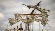 Crew members work on the mast of the Cuauhtémoc, a masted Mexican Navy training ship, at Pier 35 after it collided with the Brooklyn Bridge, Sunday, May 18, 2025, in New York.