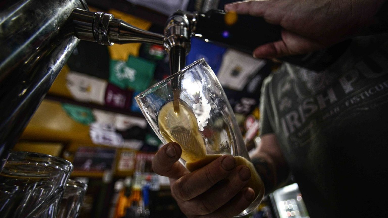 Brian Kerry, co-owner of P.K. Irish Pub in Bellows Falls, Vt., pours a pint of Guinness beer on St. Patrick's Day on Friday, March 17, 2023. 