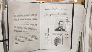 In this undated photo released by the Israeli Prime Minister's Office, identity documents of Eli Cohen are displayed