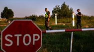 FILE - Members of the Lithuania State Border Guard Service patrol on the border with Belarus, near the village of Purvenai, Lithuania, 9 July 2021.