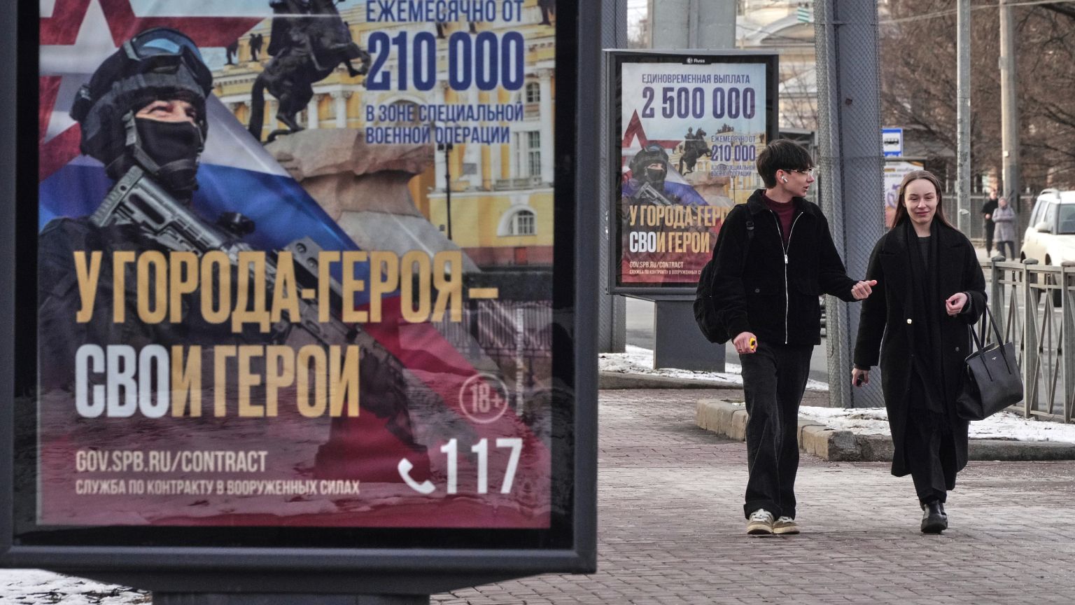 FILE: A couple walk past billboards calling for a contract for service in the Russian armed forces in St Petersburg, 15 March 2025 FILE: A couple walk past billboards calling for a contract for service in the Russian armed forces in St Petersburg, 15 March 2025