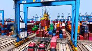 Workers load container at a container terminal, in Qingdao in east China's Shandong province on May 16, 2025.