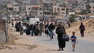 Displaced Palestinians flee from Khan Younis, Gaza, amid the ongoing Israeli military offensive in the area, on Monday, May 19, 2025.