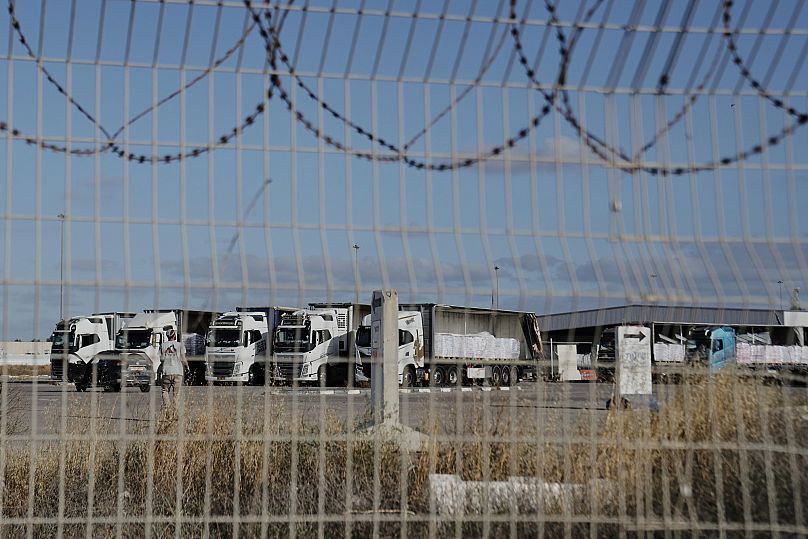 Trucks loaded with humanitarian aid for Gaza are seen at the Kerem Shalom Crossing in southern Israel, 20 May, 2025