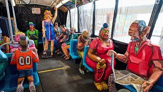 Interior view of The Bus by Red Grooms during a press preview at the Fenix Migration Museum in Rotterdam, Netherlands, Wednesday, May 14, 2025.