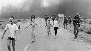 Terrified children, including 9-year-old Kim Phuc (center), flee after a napalm attack near Trang Bang, Vietnam, 8 June 1972.